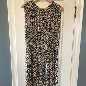 Leopard print dress with pleated folds. Great for office or casual.